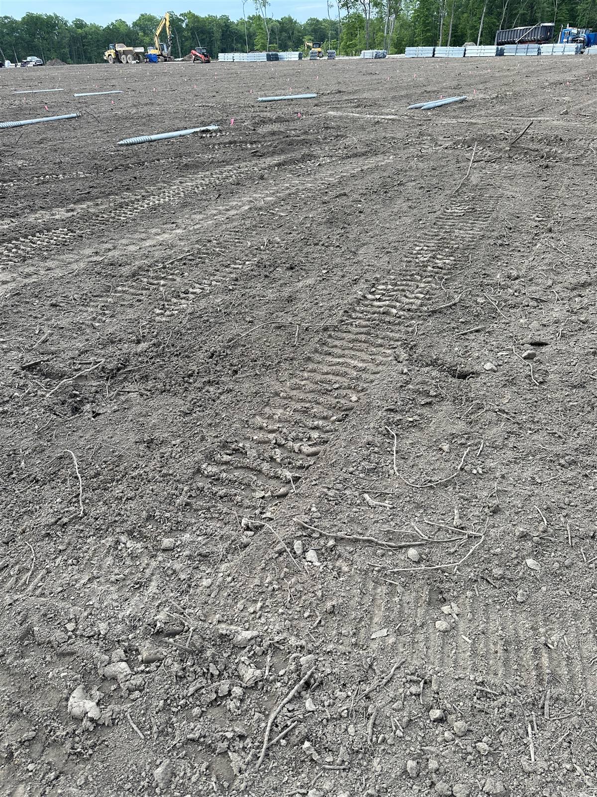 Tracked ground across a large cleared site