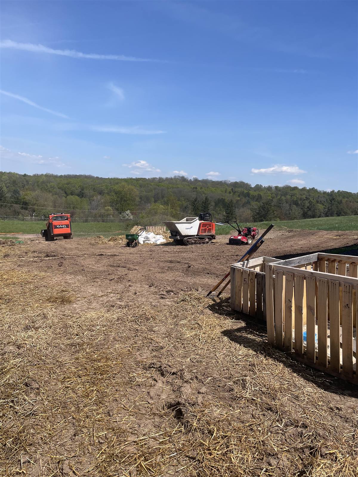 Graded ground at a solar site with materials staged beyond